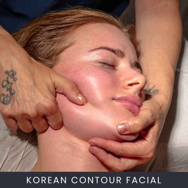a woman receiving a korean contour facial massage